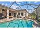 View of screened-in pool with covered patio and outdoor entertaining area, perfect for gatherings at 5621 Rock Dove Dr, Sarasota, FL 34241