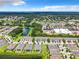 Community view showing townhomes near a lake and shops at 11650 Cambium Crown Dr, Riverview, FL 33569