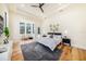 Main bedroom with king-size bed, large windows, and wood floors at 9276 Starry Night Ave, Sarasota, FL 34241