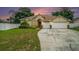 Two-car garage and well-maintained lawn at 1704 Cresswell Manor Ct, Dover, FL 33527