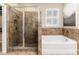 Bathroom with a large walk-in shower and a garden tub at 6404 Key Island Ave, Apollo Beach, FL 33572