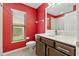 Bathroom featuring dark wood vanity and a white toilet at 10918 Rain Lilly Pass, Land O Lakes, FL 34638