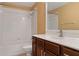 Bathroom with a tub and shower combination and a single sink vanity at 10918 Rain Lilly Pass, Land O Lakes, FL 34638