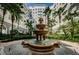 Community courtyard with a beautiful fountain and lush landscaping at 700 S Harbour Island Blvd # 722, Tampa, FL 33602