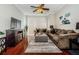 Spacious living room with hardwood floors, comfortable seating, and a large TV at 700 S Harbour Island Blvd # 722, Tampa, FL 33602