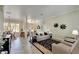 Comfortable living room featuring tile floors and neutral decor at 1116 Signature Dr, Sun City Center, FL 33573