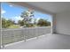 Balcony overlooking a tranquil lake and lush landscape at 15603 Serengeti Blvd, Spring Hill, FL 34610