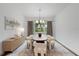 Elegant dining room with a wood table and white chairs at 15603 Serengeti Blvd, Spring Hill, FL 34610