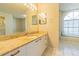 Bathroom with granite countertop, single sink, and window seat at 8360 Palm Lakes Ct, Sarasota, FL 34243