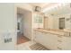 Bright bathroom with granite countertop and double sinks at 8360 Palm Lakes Ct, Sarasota, FL 34243