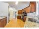 Kitchen boasts granite countertops and ample cabinetry at 8360 Palm Lakes Ct, Sarasota, FL 34243