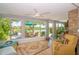 Sunroom with water views, comfortable seating, and plenty of natural light at 1816 Union St, Clearwater, FL 33763