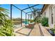 Relaxing canal view from the screened patio, perfect for enjoying the Florida lifestyle at 617 Islebay Dr, Apollo Beach, FL 33572