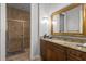 Elegant bathroom with granite vanity and a walk-in shower at 24155 Hideout Trl, Land O Lakes, FL 34639