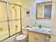 Updated bathroom featuring a shower/tub, sink, and toilet at 3035 Countryside Blvd # 14B, Clearwater, FL 33761