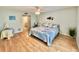 Main bedroom with king bed, ensuite bathroom access at 3035 Countryside Blvd # 14B, Clearwater, FL 33761