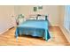 Guest bedroom with a full-size bed and light decor at 3035 Countryside Blvd # 14B, Clearwater, FL 33761