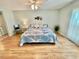 Main bedroom with a king-size bed and ceiling fan at 3035 Countryside Blvd # 14B, Clearwater, FL 33761