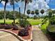 Landscaped walkway offering a view of the golf course at 3035 Countryside Blvd # 14B, Clearwater, FL 33761