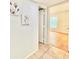 Bright hallway with light walls and wood flooring at 3035 Countryside Blvd # 14B, Clearwater, FL 33761