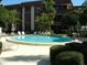 Circular pool with plenty of lounge chairs at 3035 Countryside Blvd # 14B, Clearwater, FL 33761