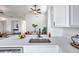 Kitchen with white cabinets, quartz countertops, and a modern sink at 13339 Laraway Dr, Riverview, FL 33579