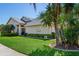 Side view of a house showcasing its architectural design and landscaping at 9132 Bassett Ln, New Port Richey, FL 34655