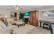 Light beige living room with sofas, TV, and wood floors at 12760 Indian Rocks Rd # 510, Largo, FL 33774