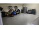 Spacious garage with epoxy flooring, storage cabinets, and room for vehicles and tools at 1513 Wharfside Dr # 1513, Tarpon Springs, FL 34689