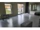 Bright and airy garage with epoxy flooring, offering versatile space with access to the outdoors at 1513 Wharfside Dr # 1513, Tarpon Springs, FL 34689