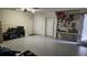 Well-equipped garage with epoxy flooring, ample storage, and workshop area at 1513 Wharfside Dr # 1513, Tarpon Springs, FL 34689