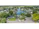 Aerial view of waterfront home community with lush landscaping and private boat docks at 8402 Bedford Ln, Tampa, FL 33615