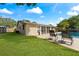 Relaxing backyard oasis with pool and lounge chairs at 8402 Bedford Ln, Tampa, FL 33615