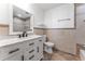 Clean bathroom with white vanity, tile shower, and bathtub at 8402 Bedford Ln, Tampa, FL 33615