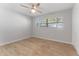 Well-lit bedroom featuring tile floors and a ceiling fan at 8402 Bedford Ln, Tampa, FL 33615