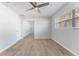 Bright bedroom with tile floors, ceiling fan and mirrored closet at 8402 Bedford Ln, Tampa, FL 33615