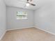 Spacious bedroom with tile floors and a window with blinds at 8402 Bedford Ln, Tampa, FL 33615