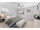 Bright bedroom with a neutral color palette and comfortable bedding at 8402 Bedford Ln, Tampa, FL 33615