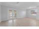 Spacious dining area with tile floors and French doors leading to the backyard at 8402 Bedford Ln, Tampa, FL 33615