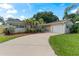 Ranch home with large driveway and nicely landscaped lawn at 8402 Bedford Ln, Tampa, FL 33615