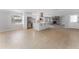 Open concept kitchen with island, stainless steel appliances, and view of living room at 8402 Bedford Ln, Tampa, FL 33615