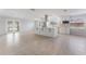 Modern kitchen with white cabinets, large island, and stainless steel appliances at 8402 Bedford Ln, Tampa, FL 33615