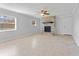 Living room featuring a brick fireplace and ceiling fan at 8402 Bedford Ln, Tampa, FL 33615