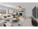 Spacious living room with fireplace and large TV at 8402 Bedford Ln, Tampa, FL 33615