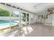 Screened pool area with tile floors and access to the backyard at 8402 Bedford Ln, Tampa, FL 33615