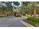 Elegant community guard house with stone accents and lush landscaping for added security at 10603 Low Oak Ter, Thonotosassa, FL 33592