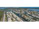 Expansive aerial view showcasing the waterfront community, canals, docks, and surrounding natural beauty at 1661 Watermark Ne Cir, St Petersburg, FL 33702