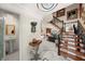 Elegant foyer with intricate tile flooring, a curved staircase, and decorative art at 1661 Watermark Ne Cir, St Petersburg, FL 33702