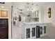 Modern kitchen with beverage center features stainless appliances, white cabinets at 1661 Watermark Ne Cir, St Petersburg, FL 33702