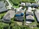 Aerial view of the home's back showing a screened pool and patio area at 5112 Coastal Scene Dr, Apollo Beach, FL 33572